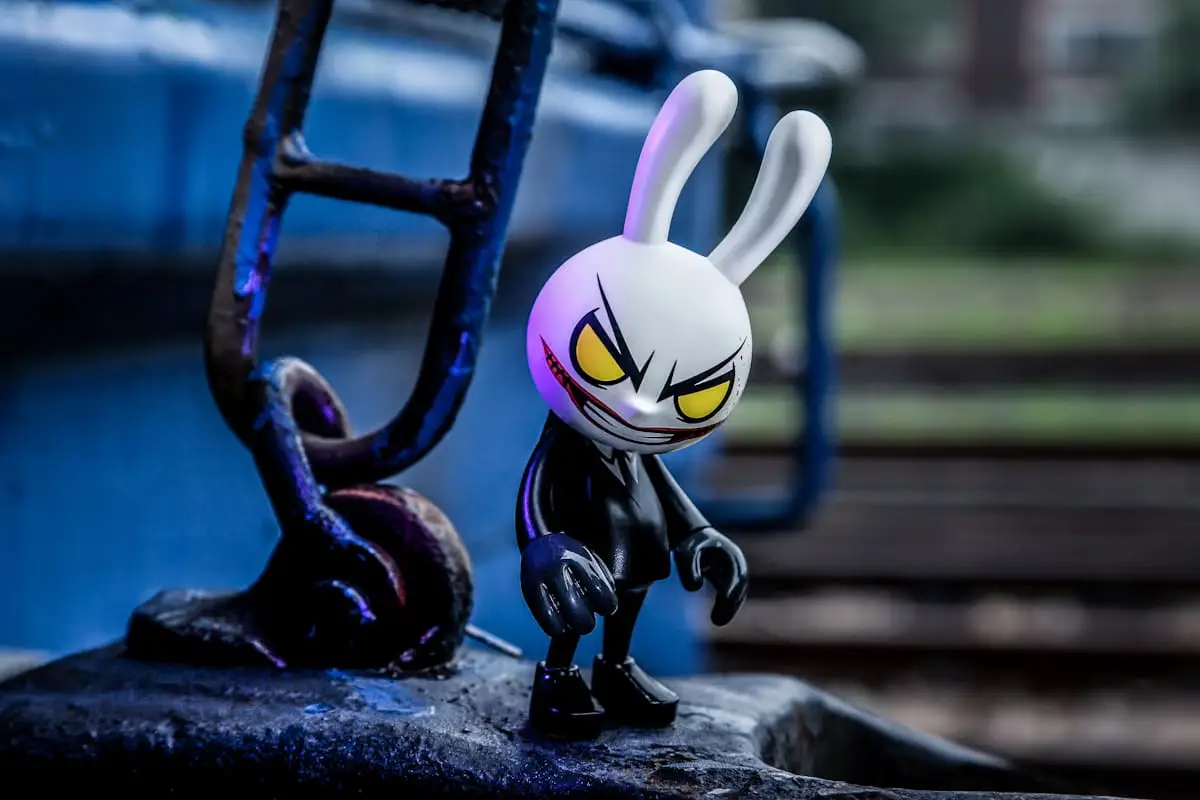Small designer art figure beside a railing